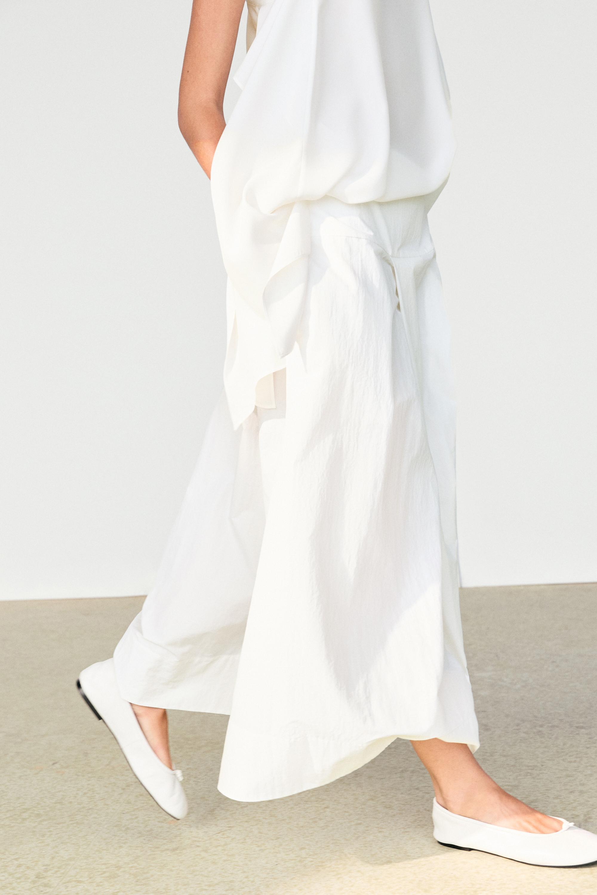 Midi skirt with yoke and pleated detail